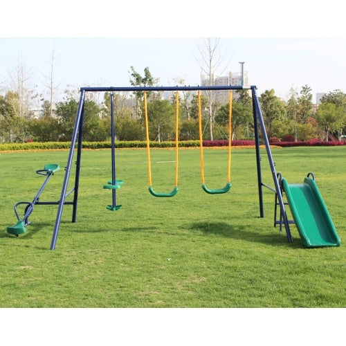 Children's playground with swings and a slide on a grassy field.